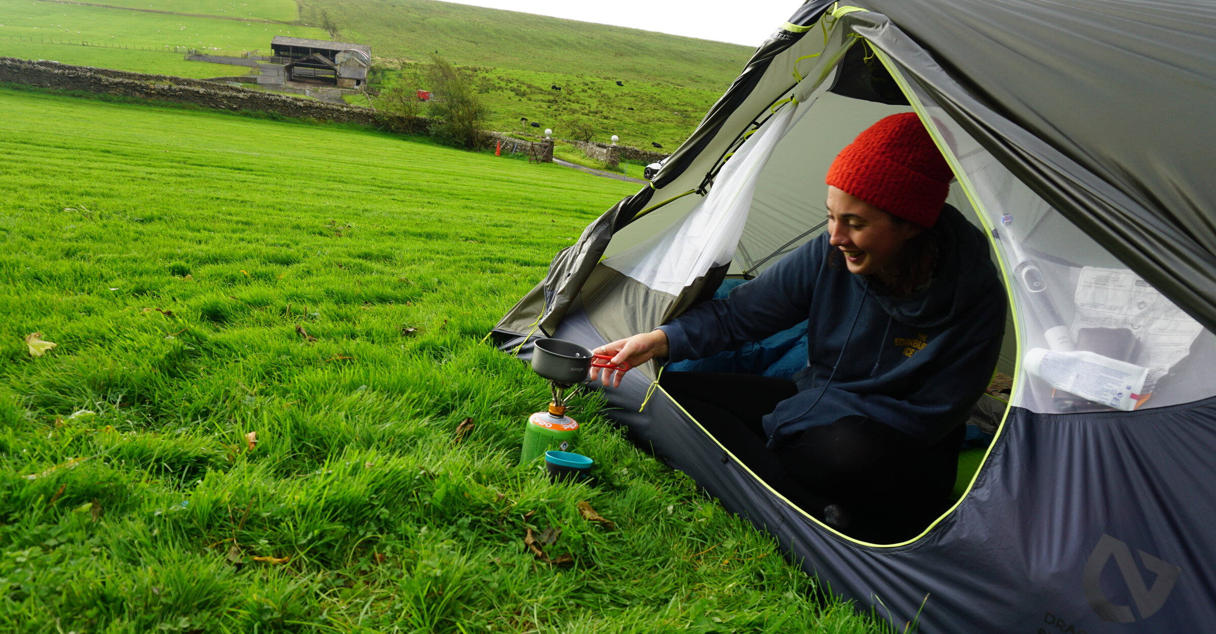 woman camping in a tent